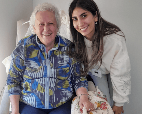A volunteer visiting her client